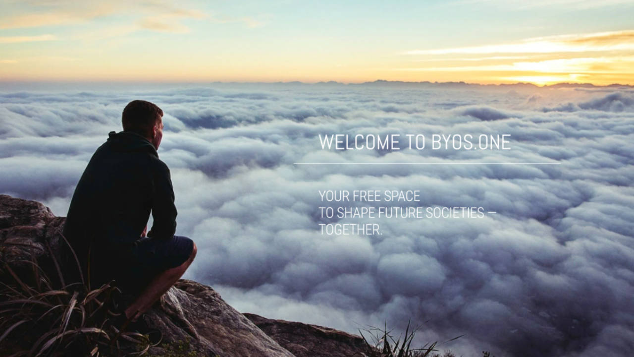 A man on top of the hill overlooking a bay of clouds while thinking about the future of society